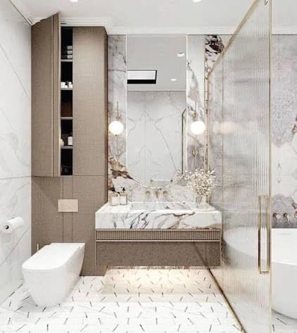 Light marble bathroom with a floating vanity and glass shower